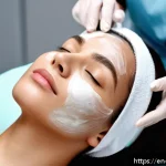 Home 19 피부과 부위별 시술 종류 - A close-up portrait of a young adult woman with clear, glowing skin undergoing a professional facial...